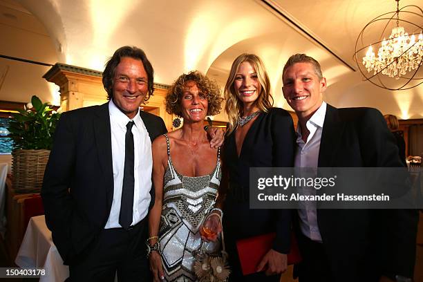 Hans-Wilhelm Mueller Wohlfahrt poses with his wife Karin Mueller Wohlfahrt; Sarah Brandner and Bastian Schweinsteiger during Hans-Wilhelm Mueller...