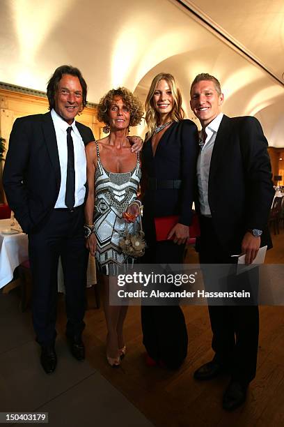 Hans-Wilhelm Mueller Wohlfahrt poses with his wife Karin Mueller Wohlfahrt; Sarah Brandner and Bastian Schweinsteiger during Hans-Wilhelm Mueller...