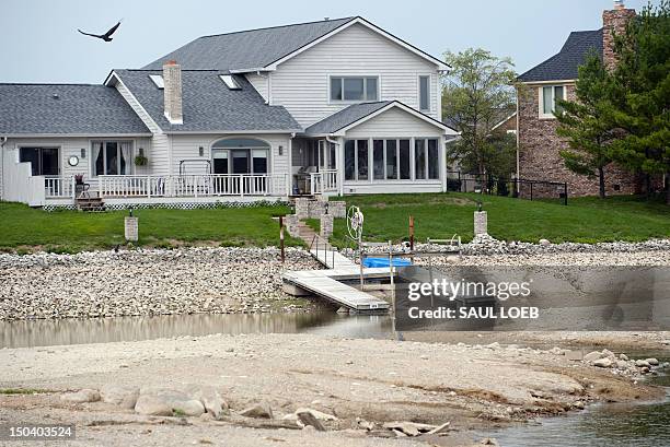 Boat dock is left high and dry at the Morse Reservoir in Noblesville, Indiana, August 16 as water depths are significantly lower than average due to...