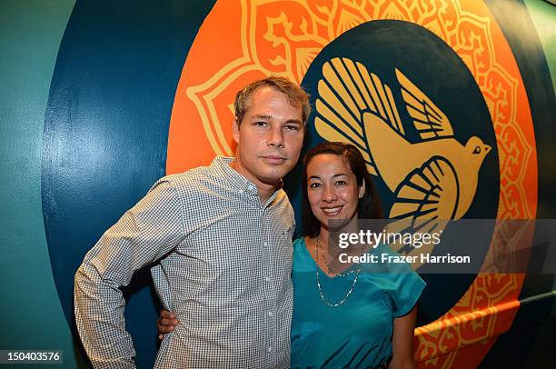 Artist Shepard Fairey and wife Amanda Fairey attend the offcial unveiling of a wall that he donated to the USC Hospital through the art of Elysium's...