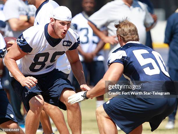 Dallas Cowboys tight end John Phillips works against linebacker Sean Lee during training camp in Oxnard, California, on Thursday, August 16, 2012....