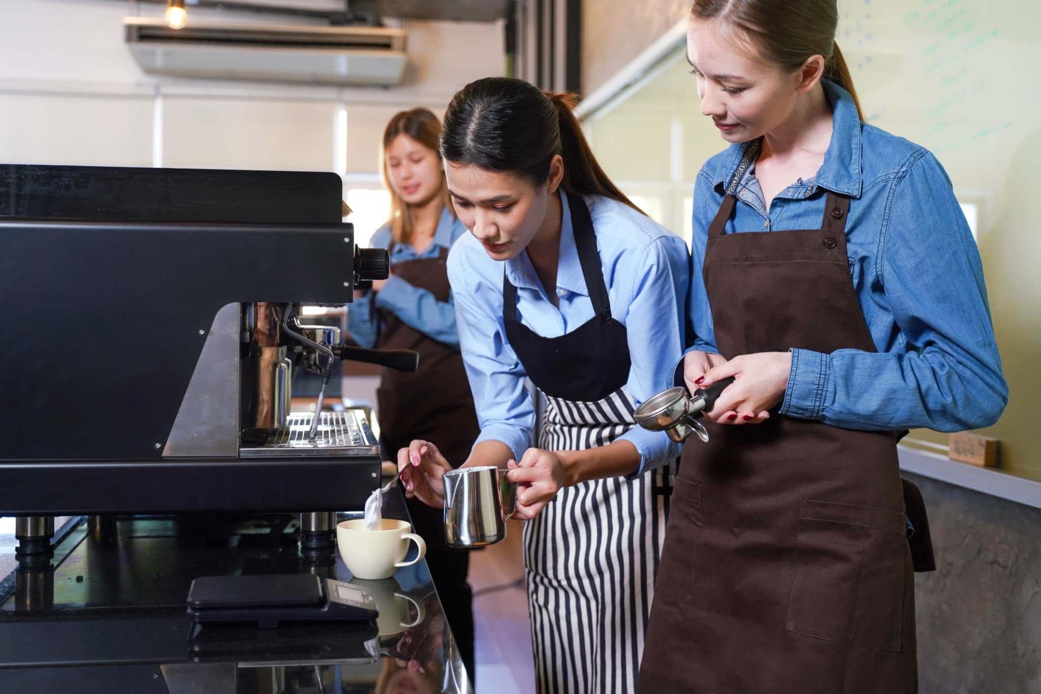 Group young woman people leaning and education workshop for classes barista coffee in cafe room Group young woman people leaning and education workshop for classes barista coffee in cafe room