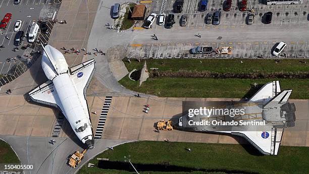 This is the last time that two space shuttles, Endeavour, left, and Atlantis will meet nose-to-nose Thursday, August 16, 2012 at the Kennedy Space...