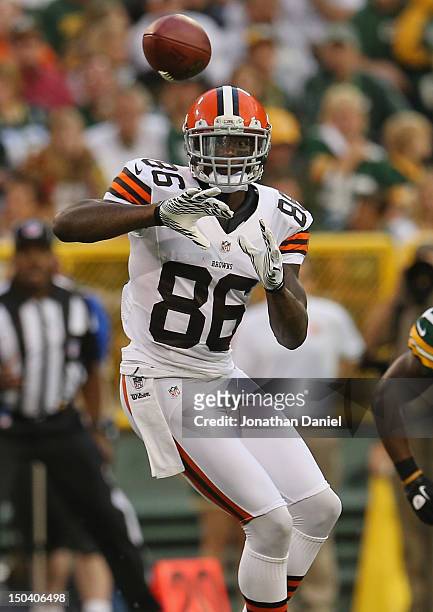 Josh Gordon of the Cleveland Browns catches a pass against the Green Bay Packers during a preseason game at Lambeau Field on August 16, 2012 in Green...