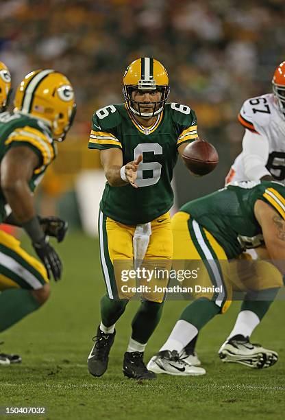 Graham Harrell of the Green Bay Packers pitches the ball against the Cleveland Browns during a preseason game at Lambeau Field on August 16, 2012 in...