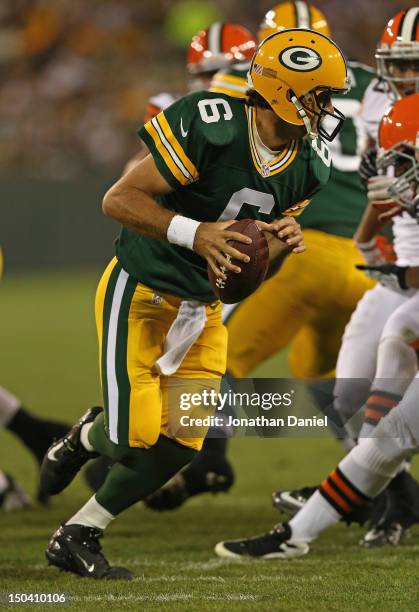 Graham Harrell of the Green Bay Packers rolls out against the Cleveland Browns during a preseason game at Lambeau Field on August 16, 2012 in Green...