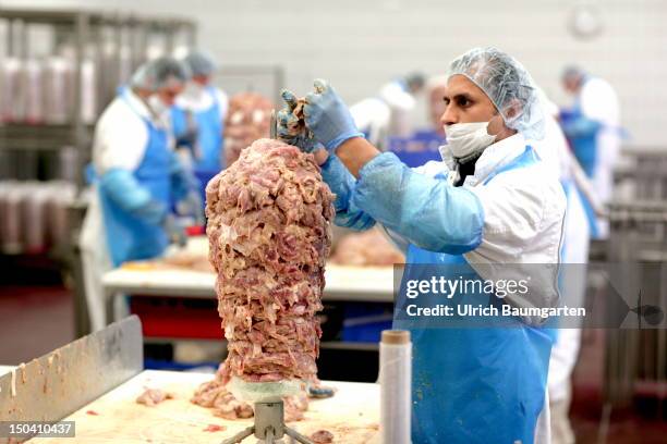 Worker prepares a Doener Kebab meat skewer at Karmez Doenerfabrik GmbH, on July 31, 2012 in Frankfurt am Main, Germany.