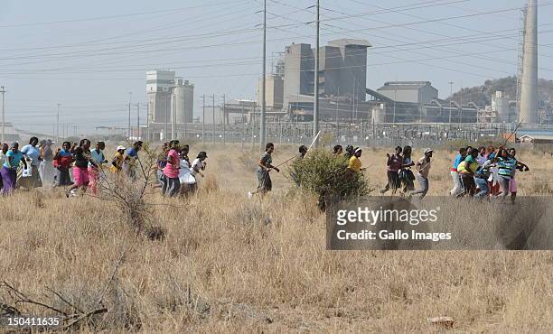 Women join the mine workers as they protest outside the Nkageng informal settlement on August 16, 2012 in North West, South Africa. At least 10...