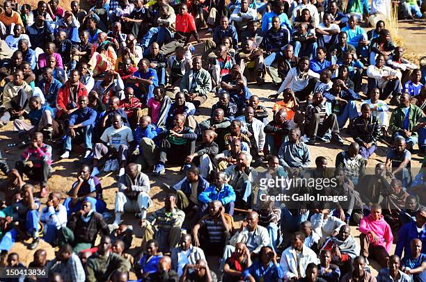 Thousands of striking mine workers demonstrate on a hill near Lonmin's Karee Platinum Mine demanding a wage increase on August 16, 2012 in...