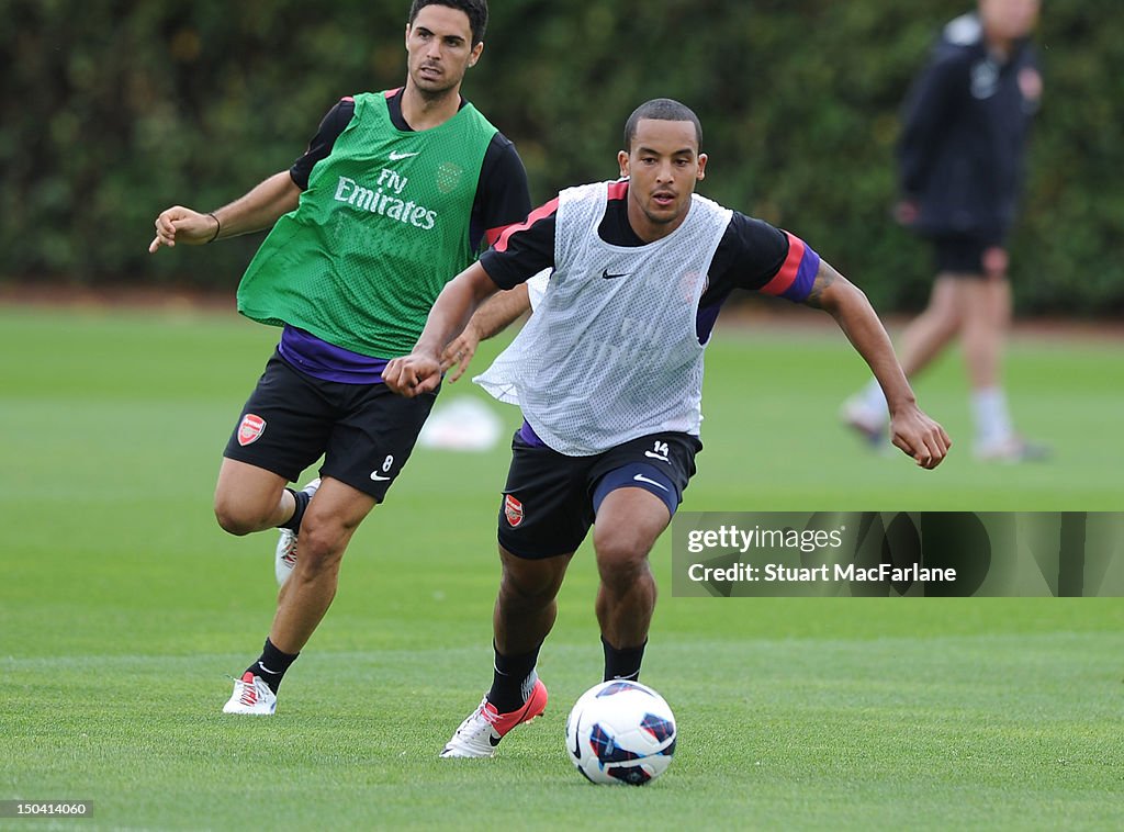 L-R Mikel Arteta and Theo Walcott of Arsenal during a training... News