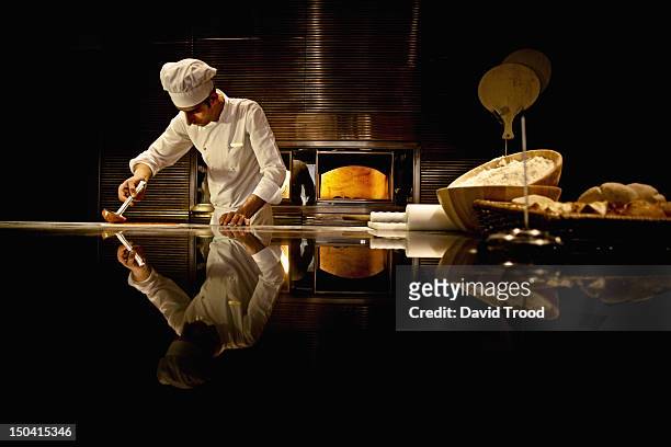 chef working in industrial kitchen. - uniforme de chef fotografías e imágenes de stock