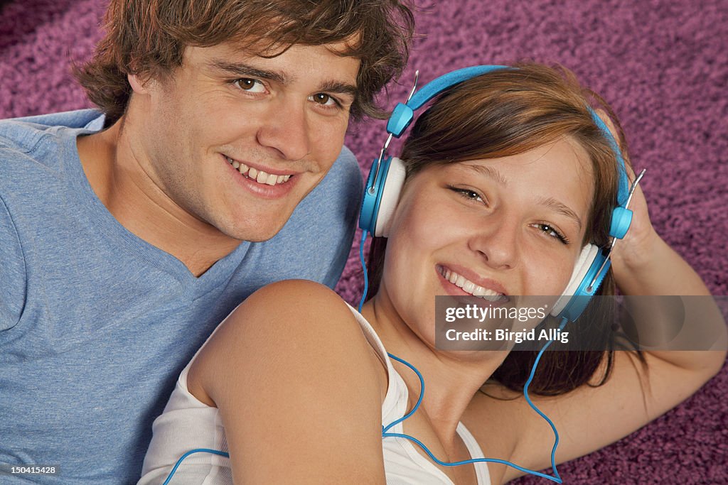 Young couple with head phones