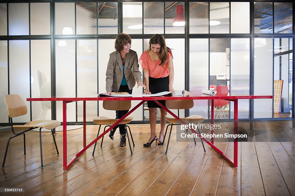 Woman discuss architectural plans