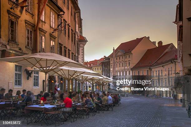 outdoor restaurant in old ljubljana - ljubljana slovenia stock pictures, royalty-free photos & images