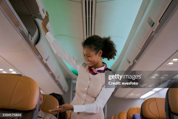 passenger travel via commercial air plane. - air stewardess stockfoto's en -beelden