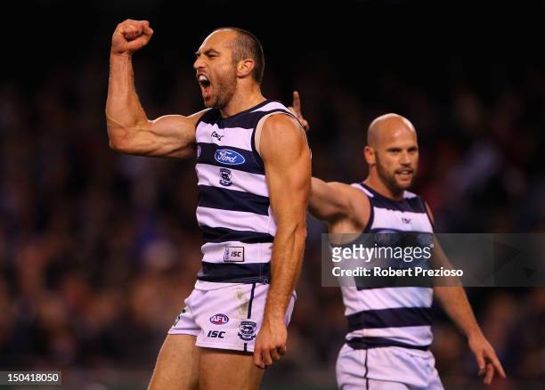 James Podsiadly of the Cats celebrates kicking a goal during the round 21 AFL match between the Geelong Cats and the St Kilda Saints at Etihad...