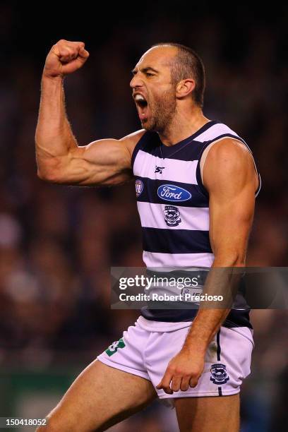 James Podsiadly of the Cats celebrates kicking a goal during the round 21 AFL match between the Geelong Cats and the St Kilda Saints at Etihad...