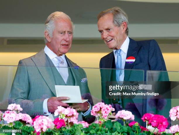 King Charles III and Charles Wellesley, 9th Duke of Wellington watch the racing from the Royal Box as they attend day one of Royal Ascot 2023 at...