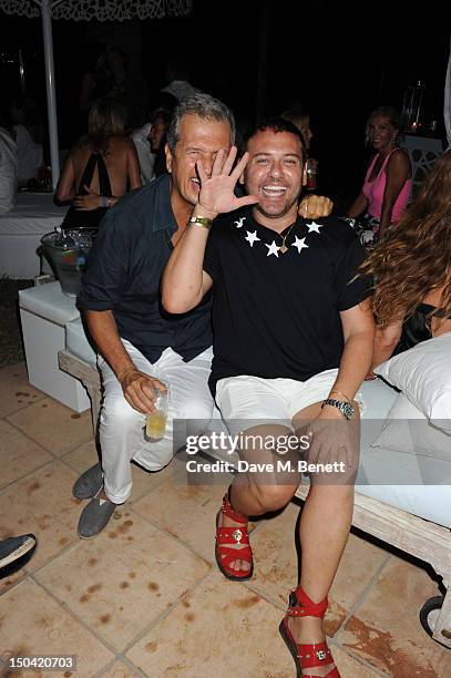 Mario Testino and guest attend the Ibiza Summer Party In Aid Of Teenage Cancer Trust and Asociacion Espanola Contra El Cancer at Groucho Ibiza on...