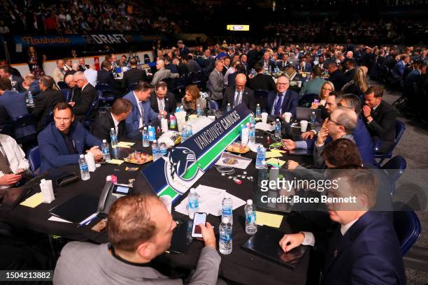 The Vancouver Canucks talk during the 2023 Upper Deck NHL Draft at Bridgestone Arena on June 29, 2023 in Nashville, Tennessee.