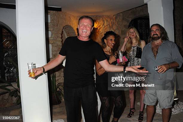 Rusty Egan, guest, Annette Felder and Arthur Baker attend the Ibiza Summer Party In Aid Of Teenage Cancer Trust and Asociacion Espanola Contra El...