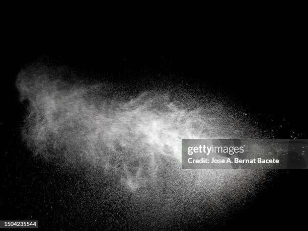 jet and cloud of water spray drops on a black background. - water sprayer photos et images de collection