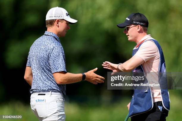 Marcus Helligkilde of Denmark celebrates with his caddie on the 5th hole during Day One of the Betfred British Masters hosted by Sir Nick Faldo 2023...