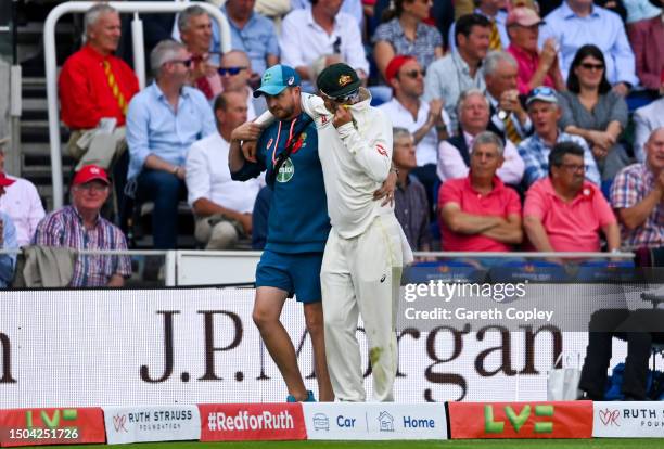 Nathan Lyon of Australia leaves the field injured during Day Two of the LV= Insurance Ashes 2nd Test match between England and Australia at Lord's...