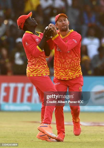 Wesley Madhevere and Craig Ervine of Zimbabwe attempt to gather the ball during the ICC Men's Cricket World Cup Qualifier Zimbabwe 2023 Super 6 match...
