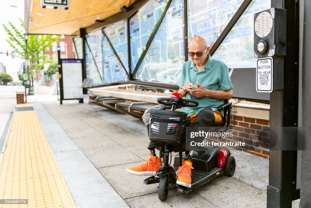 Disabled senior at bus stop