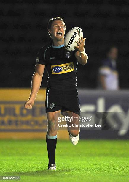 Luke Dorn of Broncos celebrates scoring his third try during the Stobart Super League match between London Broncos and Warrington Wolves at...