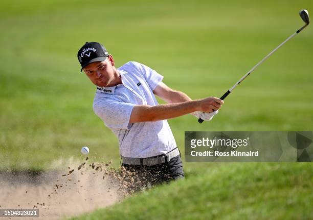 Dale Whitnell of England plays a bunker shot on the 17th hole during Day One of the Betfred British Masters hosted by Sir Nick Faldo 2023 at The...