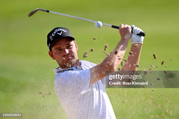 Dale Whitnell of England plays a bunker shot on the 17th hole during Day One of the Betfred British Masters hosted by Sir Nick Faldo 2023 at The...