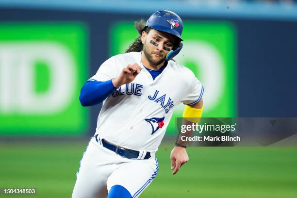 Bo Bichette of Toronto Blue Jays rounds third base to score against the San Francisco Giants during the first inning in their MLB game at the Rogers...