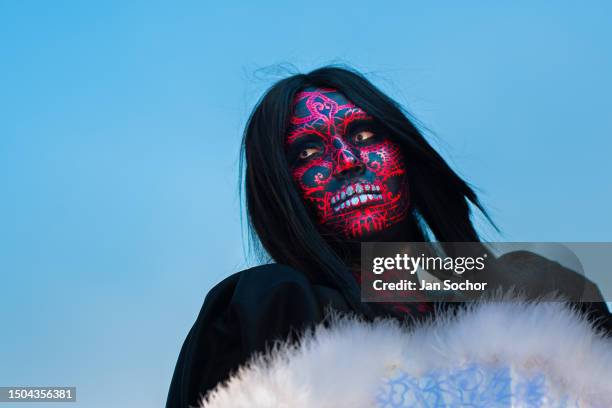 Young Mexican woman, wearing face paint, takes part in the Day of the Dead festivities on October 29, 2022 in Guadalajara, Jalisco, Mexico. Day of...