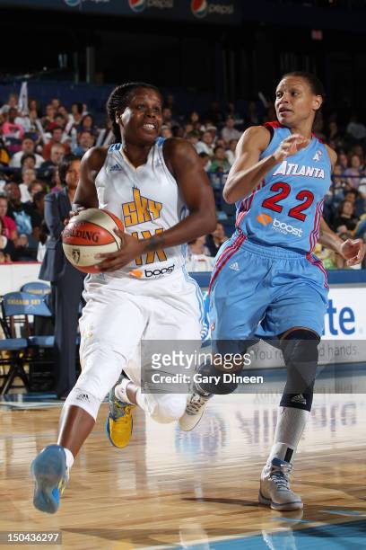 Epiphanny Prince of the Chicago Sky drives to the basket past Arminte Price of the Atlanta Dream on August 17, 2012 at the Allstate Arena in...