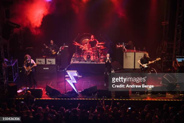 Dave Keuning, Ronnie Vannucci, Jr., Brandon Flowers and Mark Stoermer of The Killers performs on stage at O2 Academy on August 17, 2012 in Leeds,...
