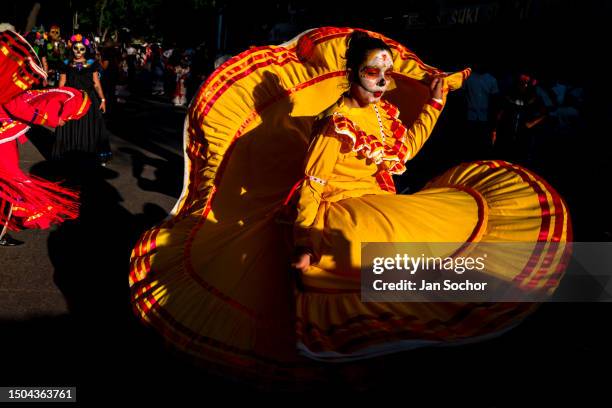 Young Mexican woman, dressed as La Catrina, performs a dance act during the Day of the Dead festivities on October 29, 2022 in Guadalajara, Jalisco,...