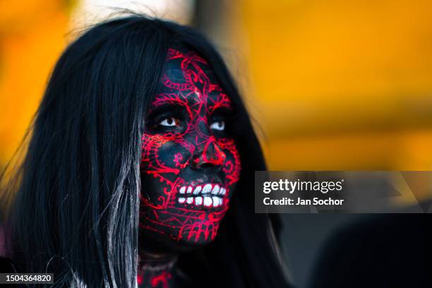 Young Mexican woman, wearing face paint, takes part in the Day of the Dead festivities on October 29, 2022 in Guadalajara, Jalisco, Mexico. Day of...