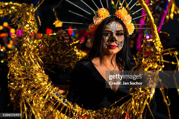 Young Mexican woman, wearing La Catrina face paint, performs a dance act during the Day of the Dead festivities on October 29, 2022 in Guadalajara,...