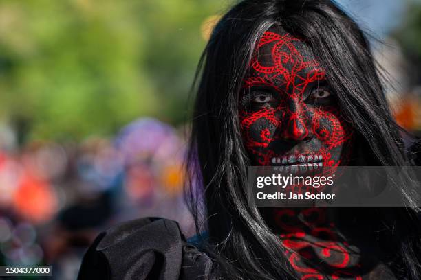 Young Mexican woman, wearing face paint, takes part in the Day of the Dead festivities on October 29, 2022 in Guadalajara, Jalisco, Mexico. Day of...