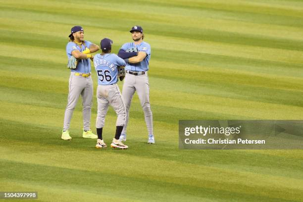 Outfielders Randy Arozarena, Jose Siri and Josh Lowe of the Tampa Bay Rays celebrate after defeating the Arizona Diamondbacks 3-2 in the MLB game at...