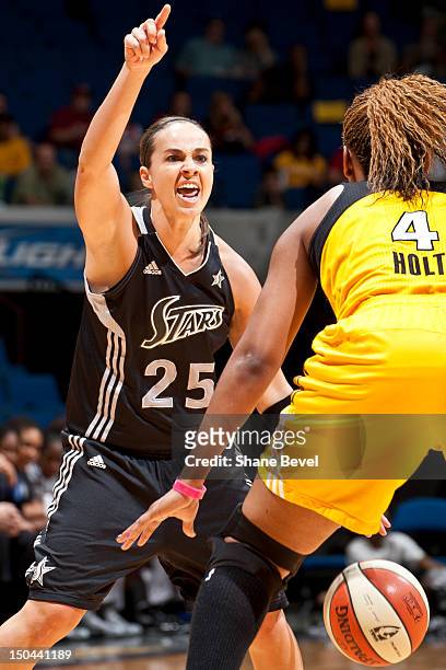 August 17: Becky Hammon of the San Antonio Silver Stars signals to her team under guard of Amber Holt of the Tulsa Shock during the WNBA game on...