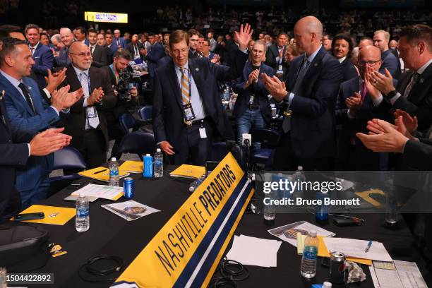 General Manager David Poile of the Nashville Predators waves after making the 218th pick during the 2023 Upper Deck NHL Draft at Bridgestone Arena on...