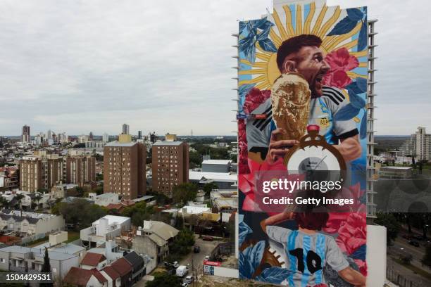 Aerial view of a giant mural by artist Cobre depicting Argentina football player Lionel Messi with the World Cup Trophy on June 29, 2023 in Santa Fe,...