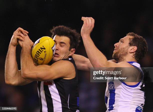 Chris Tarrant of the Magpies attempts to take a mark during the round 21 AFL match between the Collingwood Magpies and the North Melbourne Kangaroos...