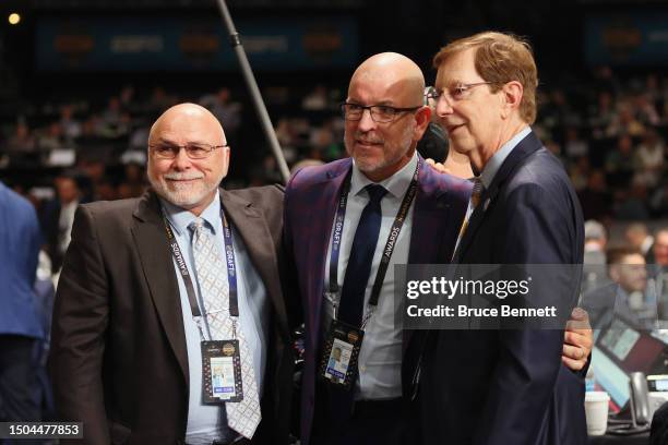 Barry Trotz, Tom Fitzgerald and David Poile pose for a photo prior to Poile's final career draft pick during the 2023 Upper Deck NHL Draft at...