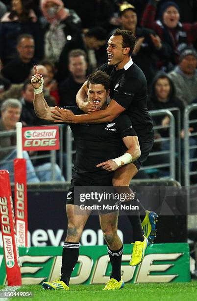 Cory Jane of the All Blacks celebrates his try during The Rugby Championship Bledisloe Cup match between Australia and New Zealand at ANZ Stadium on...