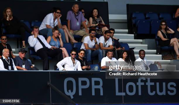 Owner Tony Fernandes and his associates look on during the Barclays Premier League match between Queens Park Rangers and Swansea City at Loftus Road...