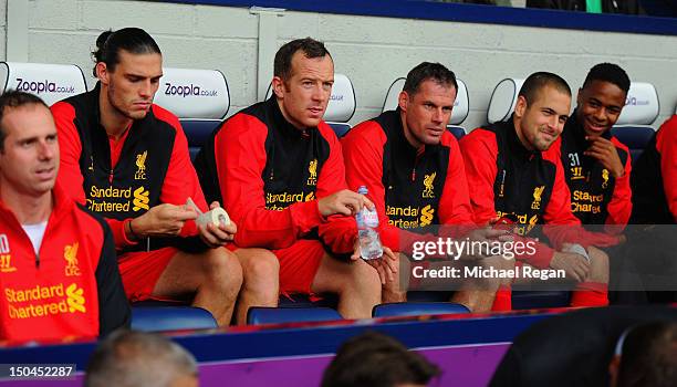 Andy Carroll, Charlie Adam, Jamie Carragher, Joe Cole and Raheem Sterling of Liverpool look on from the bench during the Barclays Premier League...